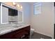 Modern bathroom with a granite countertop, stylish lighting, and a sleek design at 12650 7Th E St, Treasure Island, FL 33706