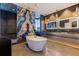 Stunning bathroom features a modern soaking tub, dual sinks, and a decorative accent wall at 12650 7Th E St, Treasure Island, FL 33706