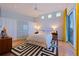 Bright bedroom with a large closet, hardwood floors, and access to the outdoor balcony at 12650 7Th E St, Treasure Island, FL 33706
