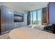 Bright bedroom with twin beds, built-in storage and water views at 12650 7Th E St, Treasure Island, FL 33706