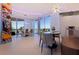 Bright dining area with modern decor and amazing waterfront views through large windows at 12650 7Th E St, Treasure Island, FL 33706