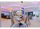 Open-concept living with dining area, modern furnishings, and architectural details at 12650 7Th E St, Treasure Island, FL 33706