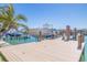 A private boat dock with a sleek design and unobstructed water access, perfect for boating enthusiasts and waterfront living at 12650 7Th E St, Treasure Island, FL 33706