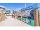 Modern boat dock with a boat lift system, offering a convenient way to access the water and stunning waterfront views at 12650 7Th E St, Treasure Island, FL 33706