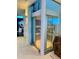 Modern home elevator with glass walls providing seamless transition between floors at 12650 7Th E St, Treasure Island, FL 33706