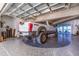 Spacious garage featuring a car turntable and a white truck, with a glass garage door providing lots of natural light at 12650 7Th E St, Treasure Island, FL 33706