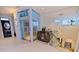 Hallway featuring an elevator, glass railings, and contemporary decor at 12650 7Th E St, Treasure Island, FL 33706