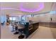Open-concept kitchen featuring an island with bar seating, modern appliances, and stunning water views at 12650 7Th E St, Treasure Island, FL 33706