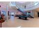 Expansive living area with pool table, staircase, and views throughout the house at 12650 7Th E St, Treasure Island, FL 33706