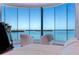 Bright main bedroom with water view, hardwood floors, and curved windows at 12650 7Th E St, Treasure Island, FL 33706
