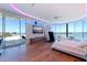 Bright main bedroom with water view, hardwood floors, and curved windows at 12650 7Th E St, Treasure Island, FL 33706