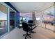Bright office space with modern glass desk, water view, and tile floors at 12650 7Th E St, Treasure Island, FL 33706