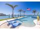Backyard pool with lounge chairs and waterfront views at 12650 7Th E St, Treasure Island, FL 33706