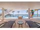 This property features a luxurious pool with outdoor lounge space and waterfront views at 12650 7Th E St, Treasure Island, FL 33706