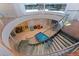 Unique staircase with glass railings, natural light and easy access to recreation room at 12650 7Th E St, Treasure Island, FL 33706