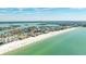 Breathtaking aerial view of the beach and coastline, showcasing its prime waterfront location with beach access at 13313 3Rd E St, Madeira Beach, FL 33708