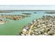Stunning aerial shot of the waterfront property, highlighting its location with easy access to the open bay and waterfront living at 13313 3Rd E St, Madeira Beach, FL 33708