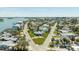 Aerial view showcases the property nestled between connecting roads and surrounded by a charming neighborhood at 13313 3Rd E St, Madeira Beach, FL 33708