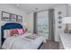 Charming bedroom with soccer decor and a large window with lots of natural light at 13434 Tropical Breeze Way, Hudson, FL 34669