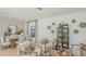 Inviting living and dining area featuring stylish furnishings and decor with neutral tones at 13458 Tropical Breeze Way, Hudson, FL 34669