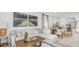 Cozy living room featuring a comfortable sectional sofa and an open-concept layout at 13458 Tropical Breeze Way, Hudson, FL 34669