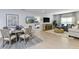 Inviting living space showcasing dining area and open view to the living room, blending comfort and style at 13478 Tropical Breeze Way, Hudson, FL 34669
