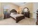 A bedroom with classic furniture and neutral tones, creating a serene atmosphere at 1509 Amarone Pl, Lutz, FL 33548