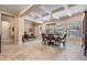 Formal dining area with coffered ceilings, travertine floors, and large windows at 1509 Amarone Pl, Lutz, FL 33548