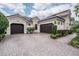 Charming home with a three-car garage and well-manicured landscaping at 1509 Amarone Pl, Lutz, FL 33548