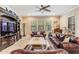 Comfortable living room with large windows providing natural light and traditional decor at 1509 Amarone Pl, Lutz, FL 33548