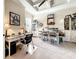 Bright and spacious office with built-in shelves and a unique ceiling fan at 1509 Amarone Pl, Lutz, FL 33548