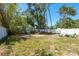 Spacious backyard with a white fence, offering privacy and room for outdoor activities at 15856 49Th N St, Clearwater, FL 33762