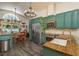 Eat-in kitchen and dining area boasting a chandelier and stainless steel appliances at 15856 49Th N St, Clearwater, FL 33762