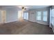 Large bedroom with carpeting, ceiling fan and light, and ample natural light at 16127 Churchview S Dr, Lithia, FL 33547