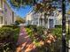 Charming home showcasing manicured landscaping and a welcoming brick pathway at 16127 Churchview S Dr, Lithia, FL 33547