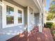 Charming front porch with brick flooring, and inviting entryway at 16127 Churchview S Dr, Lithia, FL 33547