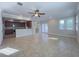 Open-concept living space with kitchen, dining, and living areas connected by tile flooring at 16127 Churchview S Dr, Lithia, FL 33547