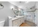 Elegant bathroom with a vessel sink, stone floors, and shower at 1613 E Del Webb Blvd, Sun City Center, FL 33573