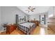 Bright bedroom features wood floors, vaulted ceiling, ceiling fan, and natural light at 1613 E Del Webb Blvd, Sun City Center, FL 33573