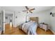 Well-lit bedroom boasts hardwood floors and features a comfortable bed at 1613 E Del Webb Blvd, Sun City Center, FL 33573