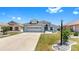 Charming single-Gathering home with a well-manicured lawn and a two-car garage at 1613 E Del Webb Blvd, Sun City Center, FL 33573