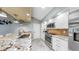 Kitchen with granite countertops, stainless steel appliances, and tiled backsplash at 1613 E Del Webb Blvd, Sun City Center, FL 33573