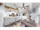 Eat-in kitchen showcases white cabinetry, granite countertops, and stainless steel appliances at 1613 E Del Webb Blvd, Sun City Center, FL 33573