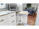 Kitchen cabinets with pull out cutting board next to the dining area at 1613 E Del Webb Blvd, Sun City Center, FL 33573