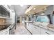 Kitchen with granite countertops, stainless steel appliances, island and tiled floor at 1613 E Del Webb Blvd, Sun City Center, FL 33573