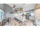 Modern kitchen with granite countertops, stainless steel appliances, a large island, tile floors and a ceiling fan at 1613 E Del Webb Blvd, Sun City Center, FL 33573
