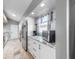 Modern kitchen features stainless steel appliances, granite countertops, and ample cabinet space at 1613 E Del Webb Blvd, Sun City Center, FL 33573