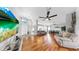 Spacious living room with hardwood floors and open floor plan at 1613 E Del Webb Blvd, Sun City Center, FL 33573
