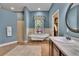 Bathroom featuring standalone tub, walk-in shower, tile floor, and single sink vanity at 16420 Iola Woods Trl, Dade City, FL 33523
