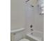 Clean bathroom featuring tiled shower/tub combo at 16420 Iola Woods Trl, Dade City, FL 33523